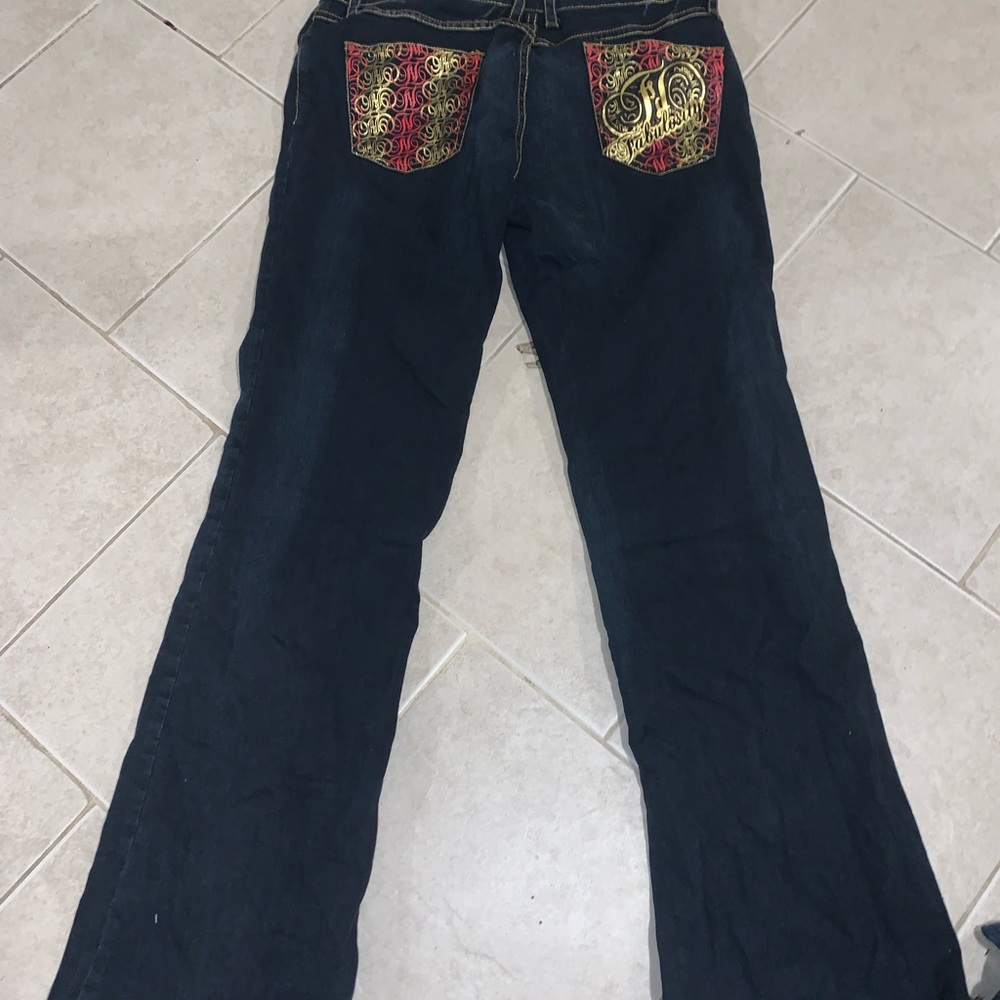 baby phat jeans dark blue and pink and gold details on back pockets, size 11